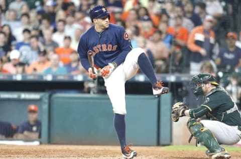 Jun 5, 2016; Houston, TX, USA; Houston Astros designated hitter George Springer (4) avoids being hit by a pitch against the Oakland Athletics in the seventh inning at Minute Maid Park. Astros won 5 to 2. Mandatory Credit: Thomas B. Shea-USA TODAY Sports