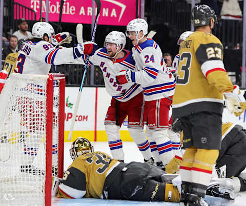 LAS VEGAS, NEVADA – DECEMBER 07: Mika Zibanejad #93, Alexis Lafrenière #13 and Kaapo Kakko #24 of the New York Rangers celebrate after Lafrenière scored a third-period goal against Logan Thompson #36 of the Vegas Golden Knights during their game at T-Mobile Arena on December 07, 2022, in Las Vegas, Nevada. The Rangers defeated the Golden Knights 5-1. (Photo by Ethan Miller/Getty Images)