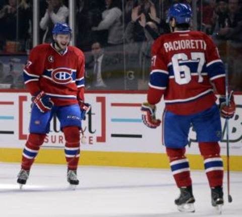 Dec 16, 2014; Montreal, Quebec, CAN; Montreal Canadiens forward Alex Galchenyuk (27) reacts with teammate Max Pacioretty (67) after scoring his second goal of the game during the third period against the Carolina Hurricanes at the Bell Centre. Mandatory Credit: Eric Bolte-USA TODAY Sports.