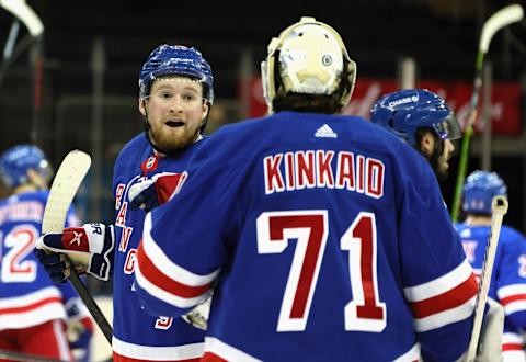 New York Rangers left wing Alexis Lafreniere (13) and goaltender Keith Kinkaid (71) celebrate after a 5-3 victory Credit: Bruce Bennett/POOL PHOTOS-USA TODAY Sports