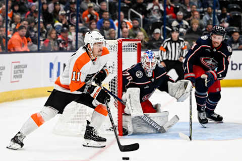 Nov 10, 2022; Columbus, Ohio, USA; Philadelphia Flyers right wing Travis Konecny (11) circles the net while Columbus Blue Jackets goaltender Joonas Korpisalo (70) tracks the puck in the third period at Nationwide Arena. Mandatory Credit: Gaelen Morse-USA TODAY Sports