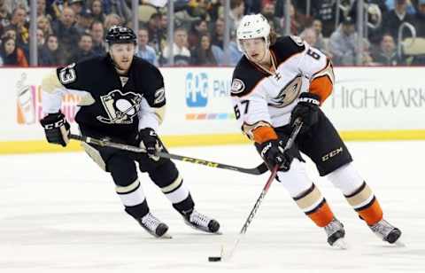 Feb 8, 2016; Pittsburgh, PA, USA; Anaheim Ducks center Rickard Rakell (67) skates with the puck as Pittsburgh Penguins center Scott Wilson (23) chases during the first period at the CONSOL Energy Center. Mandatory Credit: Charles LeClaire-USA TODAY Sports