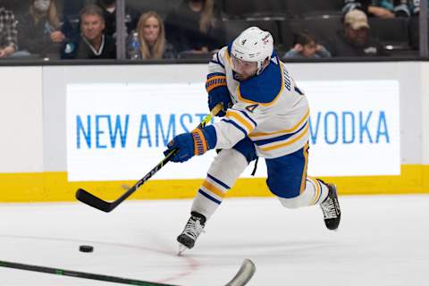 Nov 2, 2021; San Jose, California, USA; Buffalo Sabres defenseman Will Butcher (4) shoots the puck during the first period against the San Jose Sharks at SAP Center at San Jose. Mandatory Credit: Stan Szeto-USA TODAY Sports