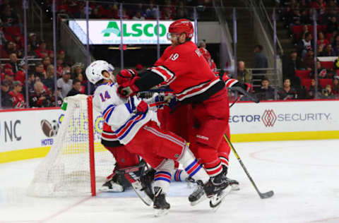 RALEIGH, NC – NOVEMBER 07: Carolina Hurricanes defenseman Dougie Hamilton (19) pushes former teammate New York Rangers center Greg McKegg (14) during the 2nd period of the Carolina Hurricanes game versus the New York Rangers on November 7th, 2019 at PNC Arena in Raleigh, NC (Photo by Jaylynn Nash/Icon Sportswire via Getty Images)