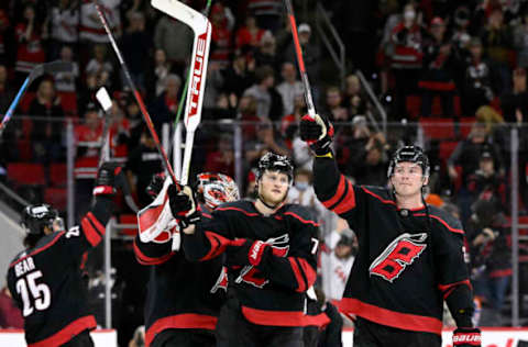 RALEIGH, NORTH CAROLINA – FEBRUARY 27: The Carolina Hurricanes celebrate with their traditional “Storm Surge” after a win against the Edmonton Oilers at PNC Arena on February 27, 2022, in Raleigh, North Carolina. The Hurricanes won 2-1. (Photo by Grant Halverson/Getty Images)