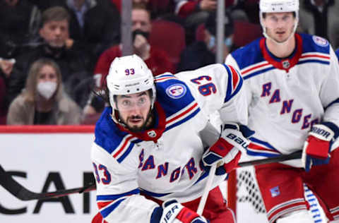 MONTREAL, QC – OCTOBER 16: Mika Zibanejad #93 of the New York Rangers skates the puck against the Montreal Canadiens during the third period at Centre Bell on October 16, 2021, in Montreal, Canada. The New York Rangers defeated the Montreal Canadiens 3-1. (Photo by Minas Panagiotakis/Getty Images)