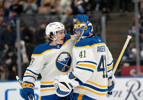 Mar 2, 2022; Toronto, Ontario, CAN; Buffalo Sabres goaltender Craig Anderson (41) celebrates the win with center Peyton Krebs (19) against the Toronto Maple Leafs at Scotiabank Arena. Mandatory Credit: Nick Turchiaro-USA TODAY Sports