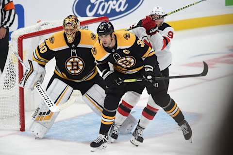 BOSTON, MA – OCTOBER 13: Zdeno Chara #33 and Tuukka Rask #40 of the Boston Bruins against Taylor Hall #9 of the New Jersey Devils at the TD Garden on October 13, 2019 in Boston, Massachusetts. (Photo by Steve Babineau/NHLI via Getty Images)