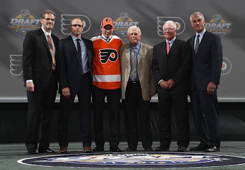 BUFFALO, NY – JUNE 24: German Rubtsov poses with team personnel after being selected 22nd overall by the Philadelphia Flyers during round one of the 2016 NHL Draft at First Niagara Center on June 24, 2016 in Buffalo, New York. (Photo by Dave Sandford/NHLI via Getty Images)