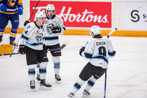 WINNIPEG, CANADA – FEBRUARY 01: Connor McClennon #94 of the Winnipeg ICE celebrates his goal with teammates Zach Benson #9 and Matthew Savoie #93 during second period action against the Saskatoon Blades at Wayne Fleming Arena on February 01, 2023 in Winnipeg, Manitoba, Canada. (Photo by Jonathan Kozub/Getty Images)