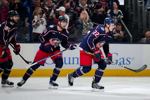 Oct 12, 2023; Columbus, Ohio, USA; Columbus Blue Jackets defenseman Jake Bean (22) celebrates with teammates center Adam Fantilli (11) and left wing Kirill Marchenko (86) after scoring a goal against the Philadelphia Flyers in the first period at Nationwide Arena. Mandatory Credit: Aaron Doster-USA TODAY Sports