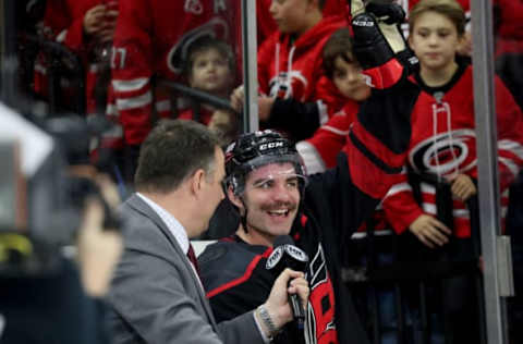 RALEIGH, NC – NOVEMBER 23: Jordan Martinook #48 of the Carolina Hurricanes acknowledges the crowd during a post game interview after scoring a hat trick during an NHL game against the Florida Panthers on November 23, 2018 at PNC Arena in Raleigh, North Carolina. (Photo by Gregg Forwerck/NHLI via Getty Images)