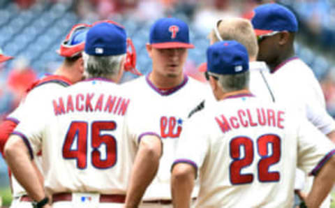 Jul 3, 2016; Philadelphia, PA, USA; Philadelphia Phillies starting pitcher Velasquez talks with manager Pete Mackanin and pitching coach McClure during a 2016 start against the Kansas City Royals. Mandatory Credit: Eric Hartline-USA TODAY Sports