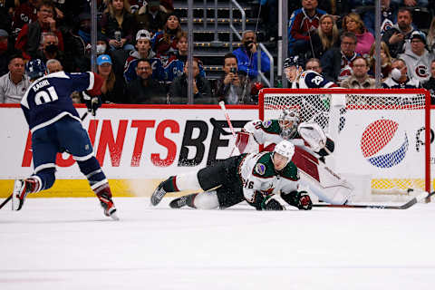 Jan 14, 2022; Denver, Colorado, USA; Arizona Coyotes defenseman Ilya Lyubushkin (46) attempts to block the shot of Colorado Avalanche center Nazem Kadri (91) ahead of goaltender Ivan Prosvetov (50) in the third period at Ball Arena. Mandatory Credit: Isaiah J. Downing-USA TODAY Sports