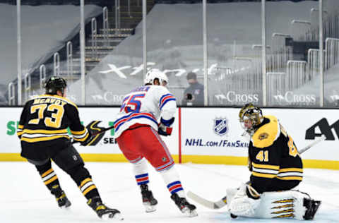 Mar 11, 2021; Boston, Massachusetts, USA; Boston Bruins goaltender Jaroslav Halak (41) makes a save on New York Rangers defenseman Ryan Lindgren (55) while defenseman Charlie McAvoy (73) during the second period at TD Garden. Mandatory Credit: Bob DeChiara-USA TODAY Sports