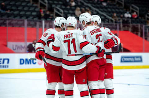 Jan 16, 2021; Detroit, Michigan, USA; Carolina Hurricanes right wing Andrei Svechnikov (37) celebrates with teammates after scoring a goal against the Detroit Red Wings at Little Caesars Arena. Mandatory Credit: Eric Bronson-USA TODAY Sports