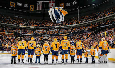 NASHVILLE, TN – MARCH 10: The Nashville Predators starting line hold hands with Children’s Hospital patients during the National Anthem on Hockey Fights Cancer night prior an NHL game against the New Jersey Devils at Bridgestone Arena on March 10, 2018 in Nashville, Tennessee. (Photo by John Russell/NHLI via Getty Images)