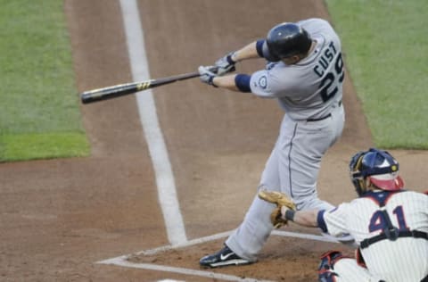 MINNEAPOLIS, MN – MAY 23: Jack Cust #29 of the Seattle Mariners hits a two-run home run as Drew Butera #41 of the Minnesota Twins catches during the first inning of their game on May 16, 2011 at Target Field in Minneapolis, Minnesota. (Photo by Hannah Foslien/Getty Images)