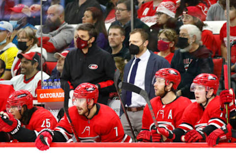 RALEIGH, NORTH CAROLINA – DECEMBER 16: Assistant coach Tim Gleason of the Carolina Hurricanes looks on during the second period of the game against the Detroit Red Wings at PNC Arena on December 16, 2021, in Raleigh, North Carolina. (Photo by Jared C. Tilton/Getty Images)