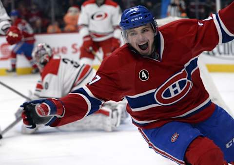 Dec 16, 2014; Montreal, Quebec, CAN; Montreal Canadiens forward Alex Galchenyuk (27) reacts after scoring his third goal of the game against Carolina Hurricanes goalie Cam Ward (30) during the third period at the Bell Centre. Mandatory Credit: Eric Bolte-USA TODAY Sports