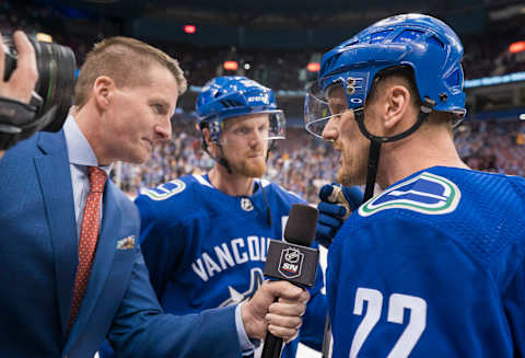 Daniel Sedin #22 and brother Henrik Sedin #33 of the Vancouver Canucks.  (Photo by Rich Lam/Getty Images)