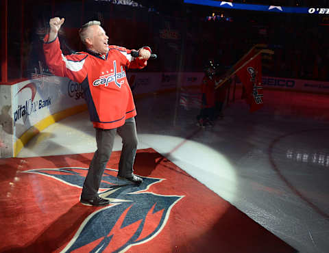 Vocalist Bob McDonald pumps his fist after singing the National Anthem before the game between the Washington Capitals and Winnipeg Jets at the Verizon Center in Washington, D.C., Tuesday, April 23, 2013. The Capitals defeated the Jets, 5-3, and claimed the NHL Southeast Division title. (Chuck Myers/MCT via Getty Images)