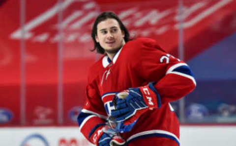 MONTREAL, QC – JANUARY 28: Alexander Romanov #27 of the Montreal Canadiens reacts after receiving a penalty against the Calgary Flames during the third period at the Bell Centre on January 28, 2021 in Montreal, Canada. The Montreal Canadiens defeated the Calgary Flames 4-2. (Photo by Minas Panagiotakis/Getty Images)