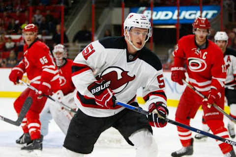 Dec 26, 2015; Raleigh, NC, USA; New Jersey Devils forward Sergey Kalinin (51) watches the play against the Carolina Hurricanes at PNC Arena. The Carolina Hurricanes defeated the New Jersey Devils 3-1. Mandatory Credit: James Guillory-USA TODAY Sports