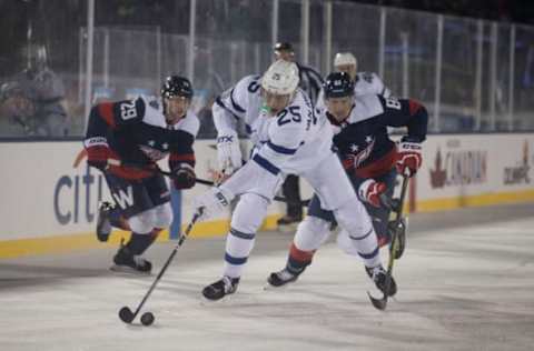 ANNAPOLIS, MD – MARCH 03: James van Riemsdyk #25 of the Toronto Maple Leafs controls the puck against Jakub Jerabek #28 and Jay Beagle #83 of the Washington Capitals during Coors Light NHL Stadium Series game at United States Naval Academy on March 3, 2018 in Annapolis, Maryland. (Photo by Mitchell Leff/Getty Images)