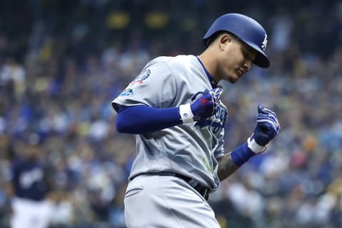 MILWAUKEE, WI – OCTOBER 12: Manny Machado #8 of the Los Angeles Dodgers celebrates after hitting a solo home run against Gio Gonzalez #47 of the Milwaukee Brewers during the second inning in Game One of the National League Championship Series at Miller Park on October 12, 2018 in Milwaukee, Wisconsin. (Photo by Rob Carr/Getty Images)