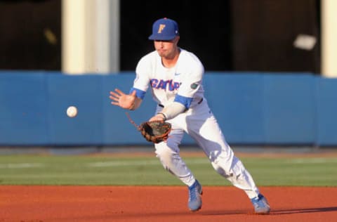 GAINESVILLE, FL – APRIL 26: Third baseman Jonathan India (6) of the Gators fields a ground ball during the college baseball game between the No. 22 Auburn Tigers and the No. 1 Florida Gators on April 26, 2018 at Alfred A. McKethan Stadium in Gainesville, Florida. (Photo by Cliff Welch/Icon Sportswire via Getty Images)