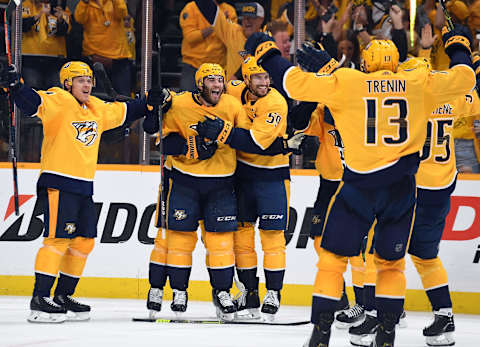 Nashville Predators center Luke Kunin (11) celebrates with teammates Mandatory Credit: Christopher Hanewinckel-USA TODAY Sports