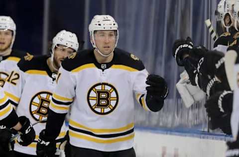 NEW YORK, NEW YORK – FEBRUARY 12: Nick Ritchie #21 of the Boston Bruins celebrates his goal with teammates on the bench in the second period against the New York Rangers at Madison Square Garden on February 12, 2021 in New York City.Due to COVID-19 restrictions games are played without fans in attendance. (Photo by Elsa/Getty Images)