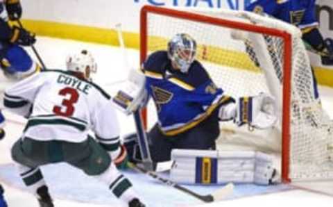 Oct 13, 2016; St. Louis, MO, USA; Minnesota Wild center Charlie Coyle (3) scores a goal over the outstretched glove of St. Louis Blues goalie Jake Allen (34) during the third period at Scottrade Center. The Blues won the game 3-2. Mandatory Credit: Billy Hurst-USA TODAY Sports