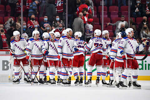 The New York Rangers celebrate their victory against the Montreal Canadiens (Photo by Minas Panagiotakis/Getty Images)