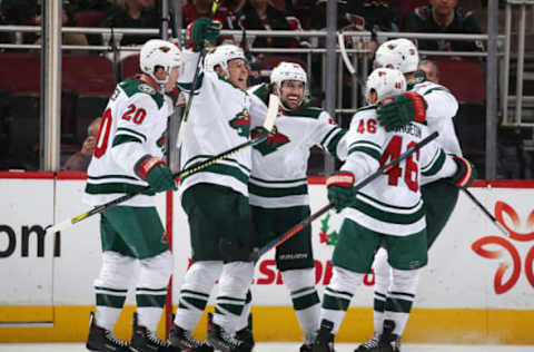 GLENDALE, ARIZONA – DECEMBER 19: (L-R) Ryan Suter #20, Zach Parise #11, Mats Zuccarello #36, Jared Spurgeon #46 and Eric Staal #12 of the Minnesota Wild celebrate after Zuccarello scored a goal against the Arizona Coyotes during the third period of the NHL game at Gila River Arena on December 19, 2019, in Glendale, Arizona. The Wild defeated the Coyotes 8-5. (Photo by Christian Petersen/Getty Images)