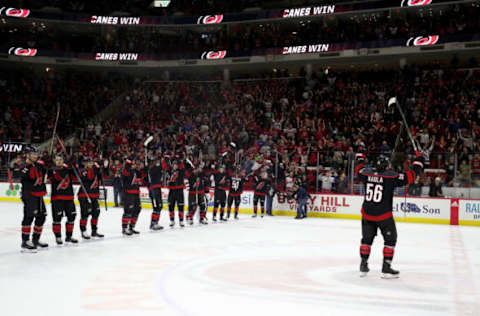 RALEIGH, NC – OCTOBER 11: Erik Haula #56 of the Carolina Hurricanes leads teammates in a Storm Squad following a victory over the New York Islanders during an NHL game on October 11, 2019 at PNC Arena in Raleigh North Carolina. (Photo by Gregg Forwerck/NHLI via Getty Images)