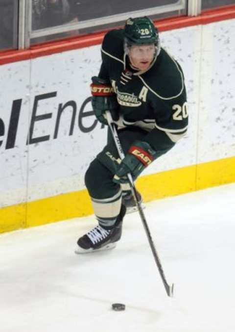 Dec 17, 2015; Saint Paul, MN, USA; Minnesota Wild defenseman Ryan Suter (20) brings the puck from behind the Wild net during the third period against the New York Rangers at Xcel Energy Center. The Wild win 5-2 over the Rangers. Mandatory Credit: Marilyn Indahl-USA TODAY Sports