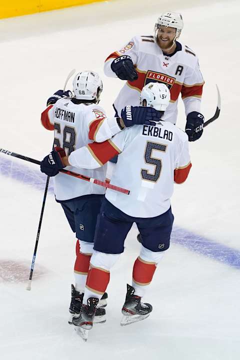 TORONTO, ONTARIO – AUGUST 04: Mike Hoffman #68 of the Florida Panthers celebrates with teammates after scoring a goal against the New York Islanders during the first period in Game Two of the Eastern Conference Qualification Round prior to the 2020 NHL Stanley Cup Playoff at Scotiabank Arena on August 4, 2020 in Toronto, Ontario. (Photo by Andre Ringuette/Freestyle Photo/Getty Images)