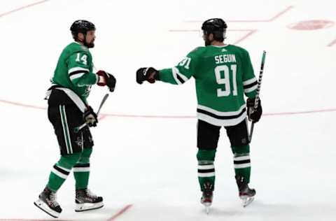 DALLAS, TEXAS – FEBRUARY 11: Jamie Benn #14 of the Dallas Stars celebrates his goal with Tyler Seguin #91 for a hat trick against the Carolina Hurricanes in the third period at American Airlines Center on February 11, 2020 in Dallas, Texas. (Photo by Ronald Martinez/Getty Images)