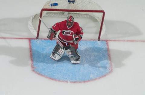 19 Feb 2004: Kevin Weekes of the Carolina Hurricanes during the Canes 2-1 (ot) loss to the Toronto Maples Leafs at the RBC Center in Raleigh, NC. (Photo by Bob Leverone/Sporting News via Getty Images via Getty Images)