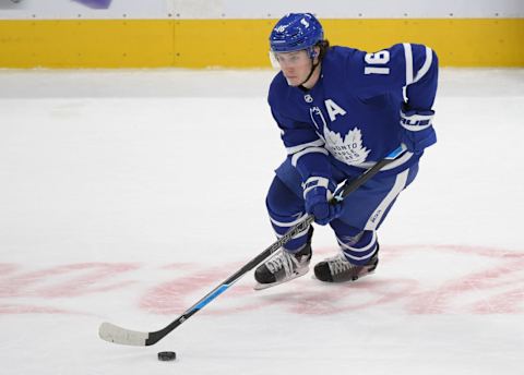 Apr 29, 2021; Toronto, Ontario, CAN; Toronto Maple Leafs forward Mitch Marner (16) skates with the puck against Vancouver Canucks in the third period at Scotiabank Arena. Mandatory Credit: Dan Hamilton-USA TODAY Sports