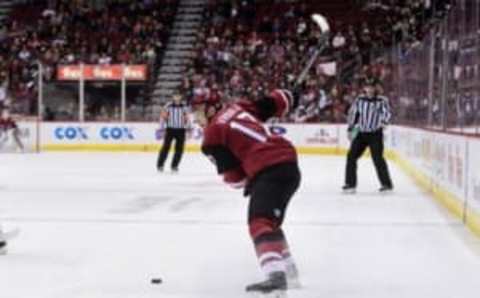 Nov 23, 2016; Glendale, AZ, USA; Arizona Coyotes right wing Radim Vrbata (17) shoots the puck during the second period against the Vancouver Canucks at Gila River Arena. Mandatory Credit: Matt Kartozian-USA TODAY Sports