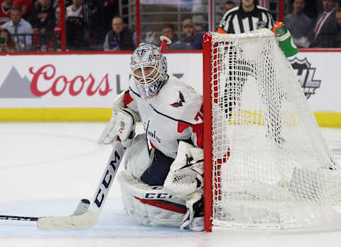 RALEIGH, NC – APRIL 15: Braden Holtby #70 of the Washington Capitals goes down in the crease and hugs the pipe to protect the net in Game Three of the Eastern Conference First Round against the Carolina Hurricanes during the 2019 NHL Stanley Cup Playoffs on April 15, 2019 at PNC Arena in Raleigh, North Carolina. (Photo by Gregg Forwerck/NHLI via Getty Images)