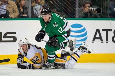 Feb 28, 2017; Dallas, TX, USA; Pittsburgh Penguins left wing Carl Hagelin (62) and Dallas Stars center Radek Faksa (12) in action during the game at the American Airlines Center. The Stars defeat the Penguins 3-2. Mandatory Credit: Jerome Miron-USA TODAY Sports