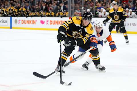 BOSTON, MASSACHUSETTS – DECEMBER 19: Adam Pelech #3 of the New York Islanders defends Torey Krug #47 of the Boston Bruins during the third period at TD Garden on December 19, 2019 in Boston, Massachusetts. (Photo by Maddie Meyer/Getty Images)