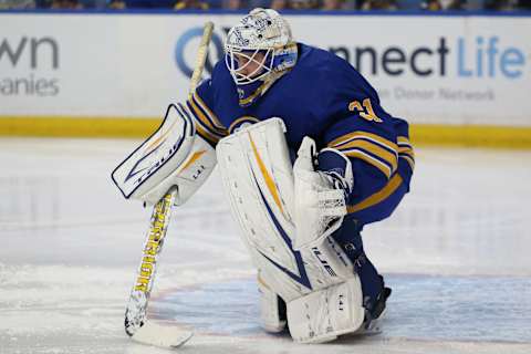 BUFFALO, NEW YORK – OCTOBER 16: Dustin Tokarski #31 of the Buffalo Sabres during warmups before the game against the Arizona Coyotes at KeyBank Center on October 16, 2021 in Buffalo, New York. (Photo by Joshua Bessex/Getty Images)