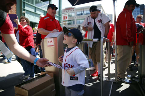 BOSTON – APRIL 13: TJ Gonick, 3, of Nutley, NH, is first through the turnstiles during the Red Sox home opener at Fenway Park in Boston on April 13, 2015. (Photo by Jessica Rinaldi/The Boston Globe via Getty Images)