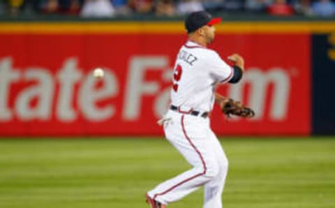 ATLANTA, GA – SEPTEMBER 26: Alex Gonzalez #2 of the Atlanta Braves loses the ball while attempting to turn a double play on the Philadelphia Phillies in the second inning at Turner Field on September 26, 2011 in Atlanta, Georgia. (Photo by Kevin C. Cox/Getty Images)