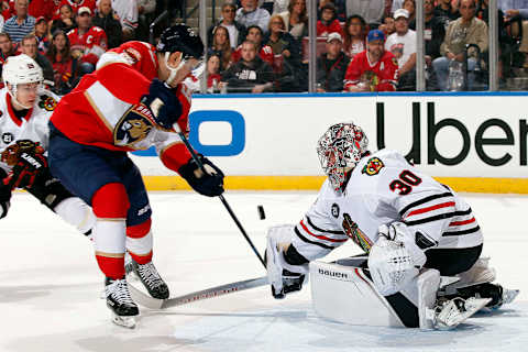 SUNRISE, FL – NOVEMBER 24: Goaltender Cam Ward #30 of the Chicago Blackhawks defends the net against Evgeni Dadonov #63 of the Florida Panthers at the BB&T Center on November 24, 2018 in Sunrise, Florida. (Photo by Eliot J. Schechter/NHLI via Getty Images)